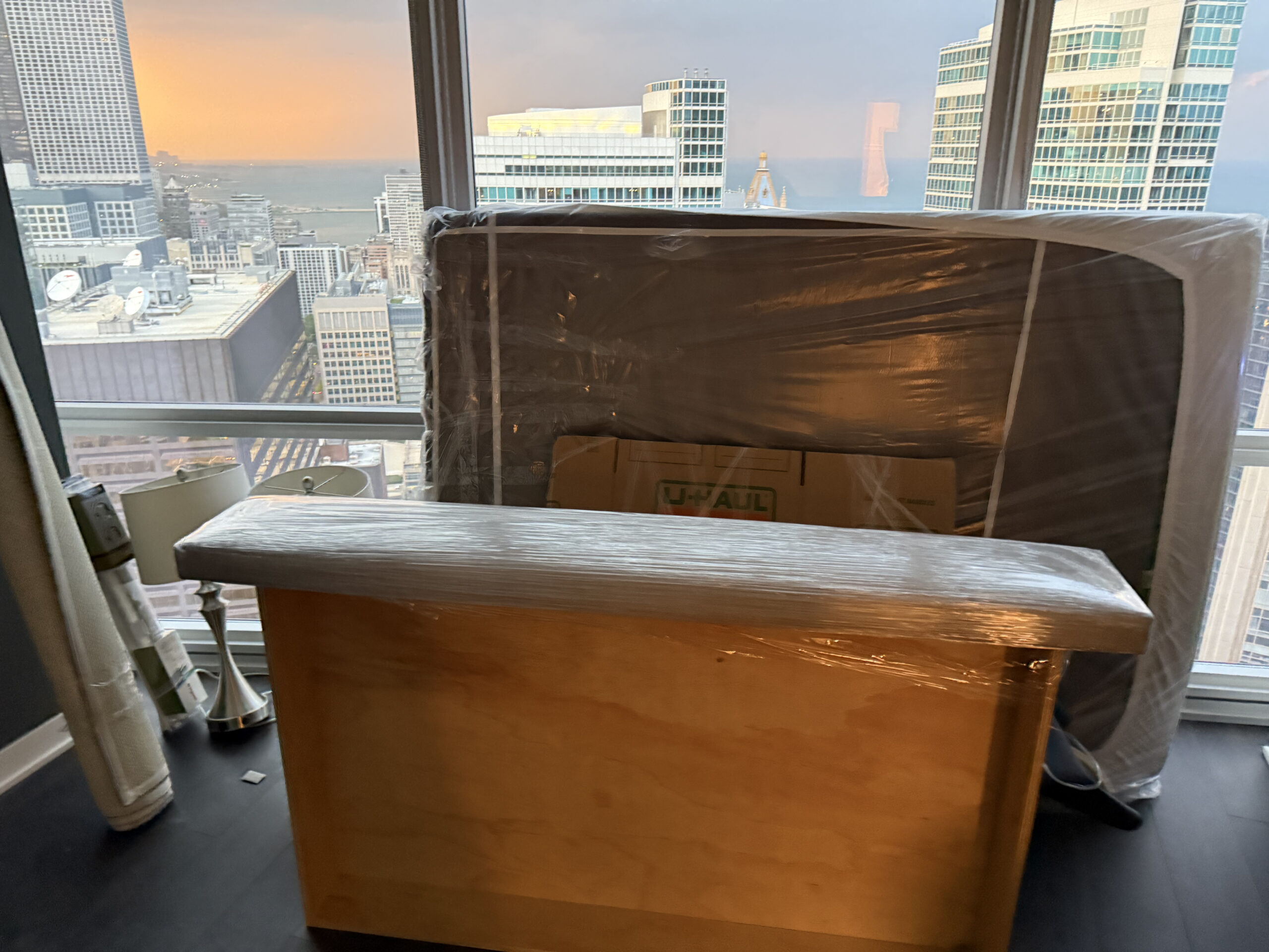 neatly wrapped furniture in cellophane for moving